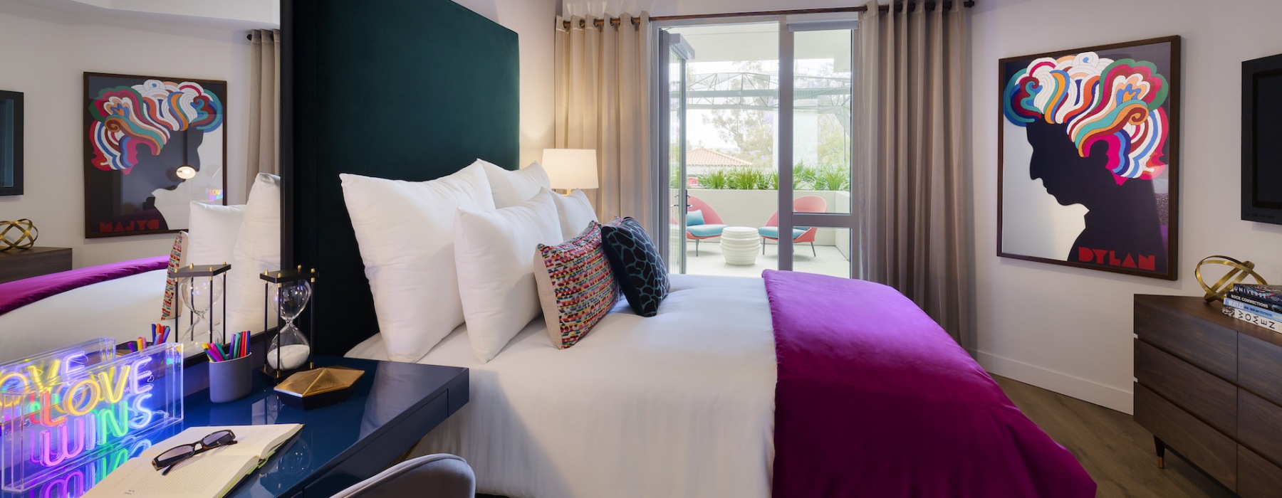 a bedroom with a bed and desk
